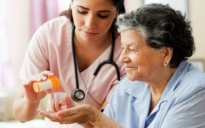 Caregiver listening to elderly patient's story